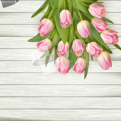 Image of Beautiful pink tulips on wooden background. EPS 10