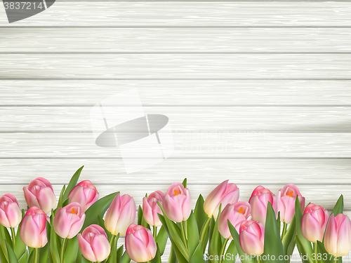 Image of Colorful tulips on wooden table. EPS 10 