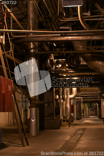 Image of assortment of different size and shaped pipes at a power plant