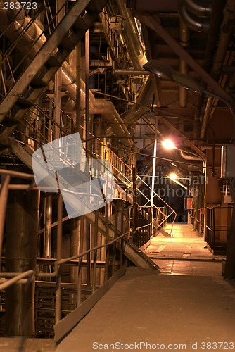 Image of Pipes and tubes and chimney at a power plant