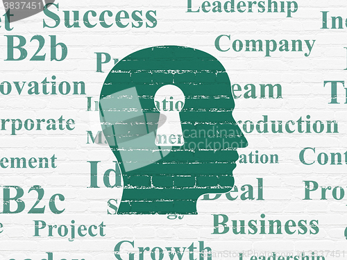 Image of Business concept: Head With Keyhole on wall background