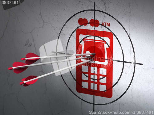 Image of Money concept: arrows in ATM Machine target on wall background