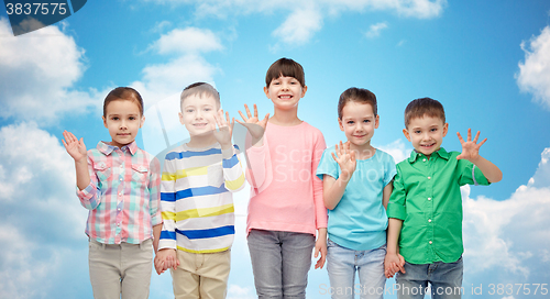 Image of happy smiling little children holding hands