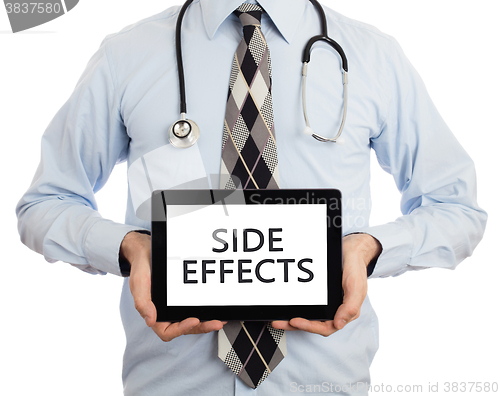 Image of Doctor holding tablet - Side effects