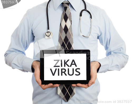 Image of Doctor holding tablet - Zika virus