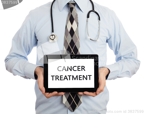 Image of Doctor holding tablet - Cancer treatment