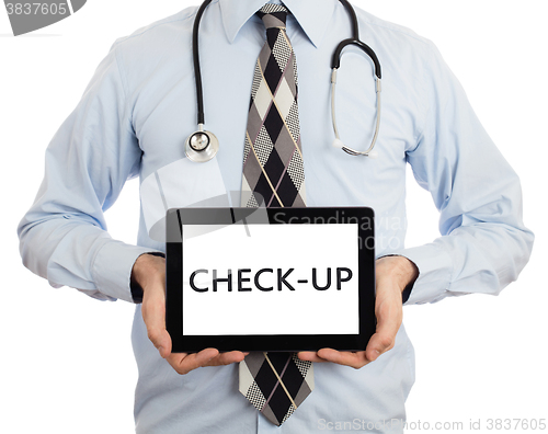 Image of Doctor holding tablet - Check-up
