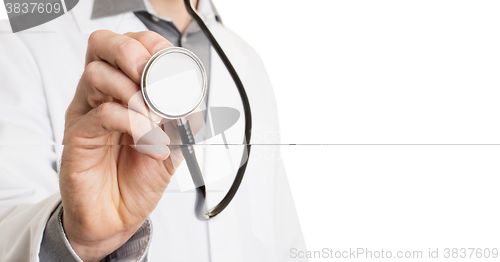 Image of Close up of a Doctor\'s hand, holding a stethoscope 