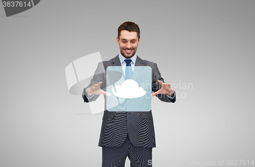 Image of businessman working with cloud icon projection