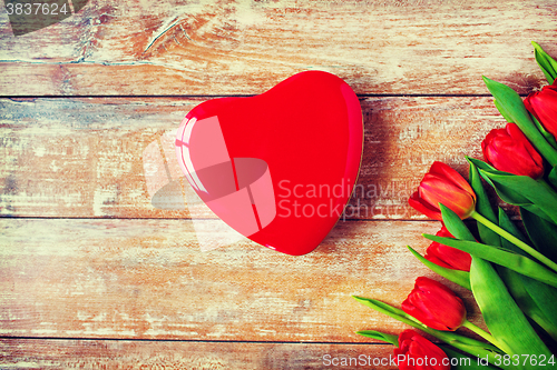 Image of close up of red tulips and chocolate box