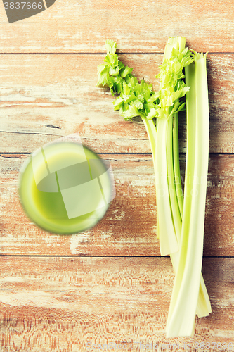 Image of close up of fresh green juice glass and celery