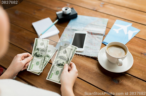 Image of close up of traveler hands counting dollar money