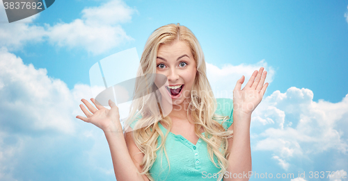 Image of surprised smiling young woman or teenage girl