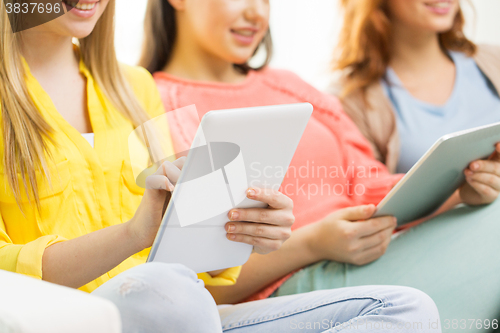 Image of close up of young women with tablet pc at home