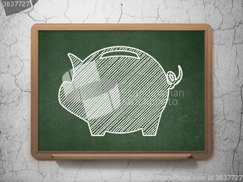 Image of Banking concept: Money Box on chalkboard background