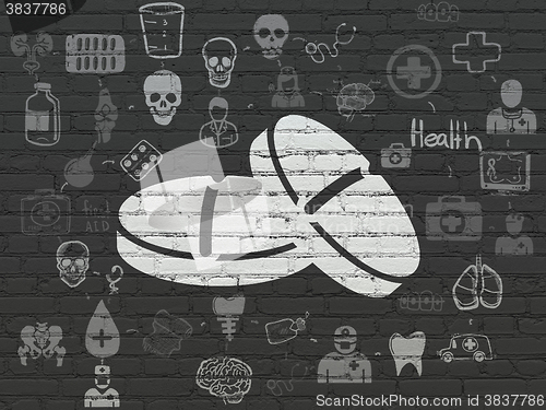 Image of Medicine concept: Pills on wall background