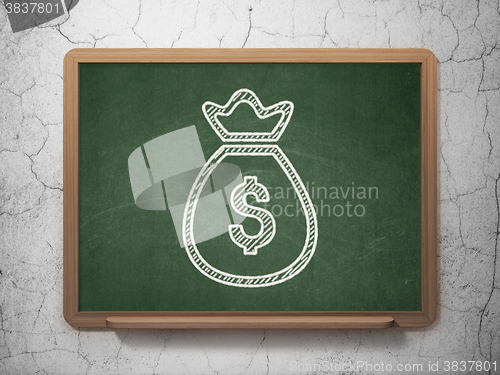 Image of Money concept: Money Bag on chalkboard background