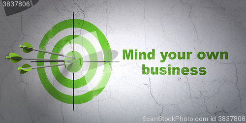 Image of Business concept: target and Mind Your own Business on wall background