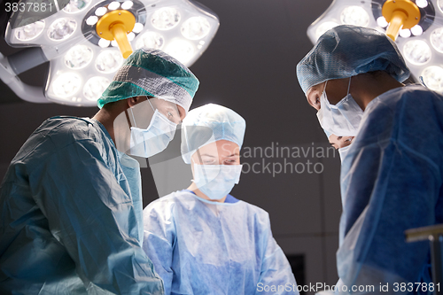 Image of group of surgeons in operating room at hospital