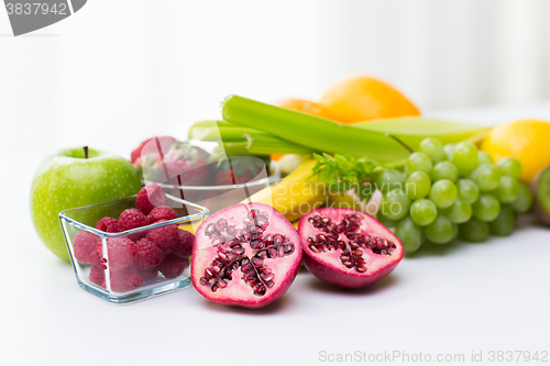 Image of close up of fresh fruits and berries on table