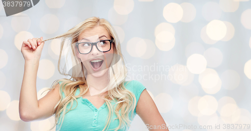 Image of happy young woman or teenage girl in glasses