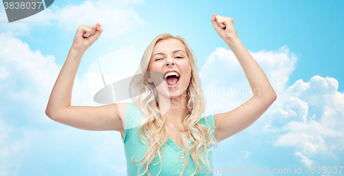 Image of happy young woman or teen girl celebrating victory