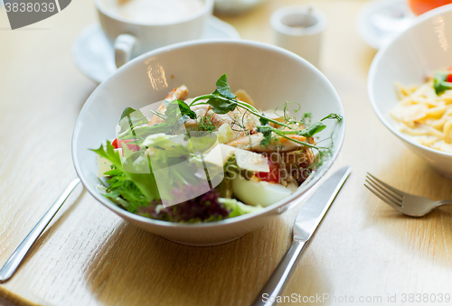 Image of close up of caesar salad on plate at restaurant