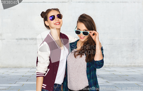 Image of happy smiling pretty teenage girls in sunglasses