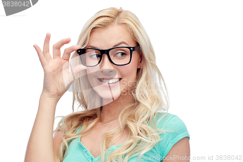 Image of happy young woman or teenage girl in glasses