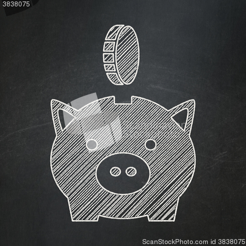 Image of Banking concept: Money Box With Coin on chalkboard background