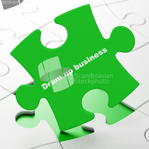 Image of Finance concept: Drum up business on puzzle background