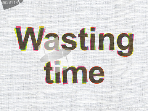 Image of Timeline concept: Wasting Time on fabric texture background