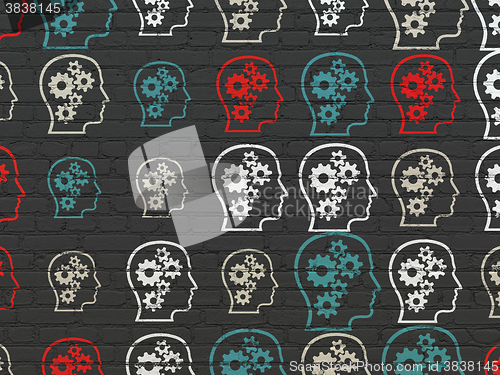 Image of Business concept: Head With Gears icons on wall background
