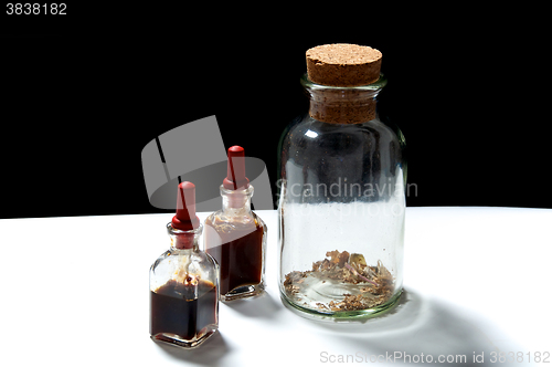 Image of glass bottles with herbal extracts oils