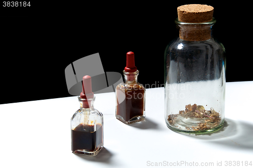 Image of three glass bottles with herbal extracts