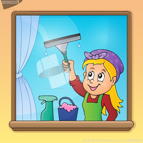 Image of Woman cleaning window image 1