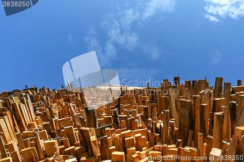 Image of Low angle view of stacked wooden planks