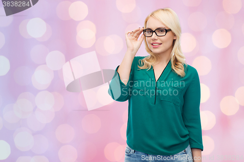 Image of smiling young woman with eyeglasses