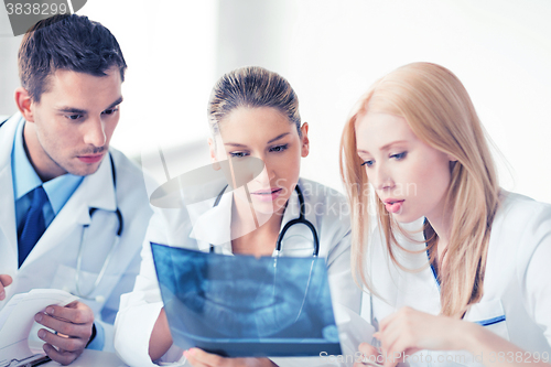 Image of young group of doctors looking at x-ray