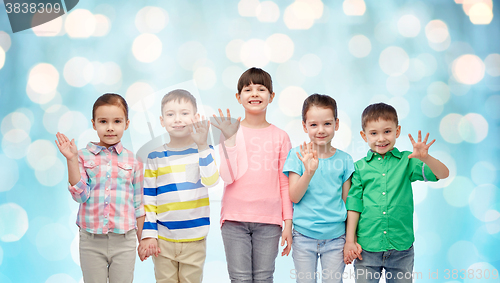 Image of happy smiling little children holding hands