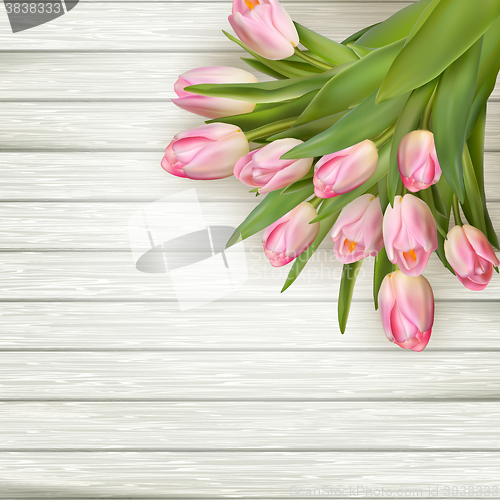 Image of Pink tulips over white wood table. EPS 10