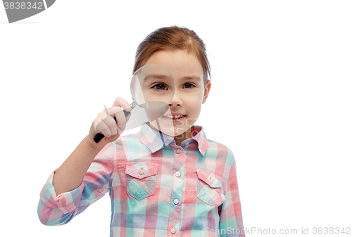 Image of happy little girl looking through magnifying glass