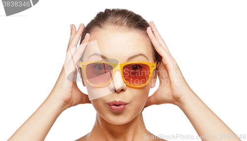 Image of surprised teenage girl in sunglasses