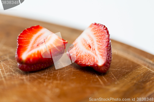 Image of close up of ripe red strawberries on cutting board