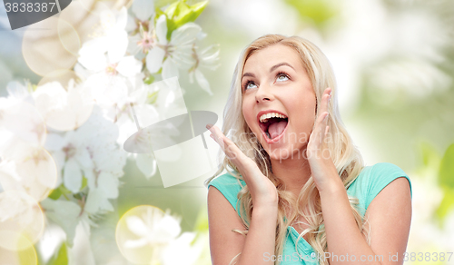 Image of surprised smiling young woman or teenage girl