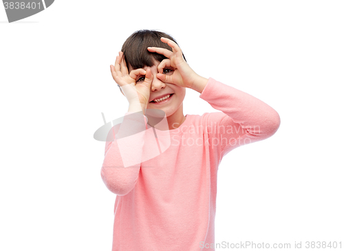 Image of happy little girl making faces and having fun