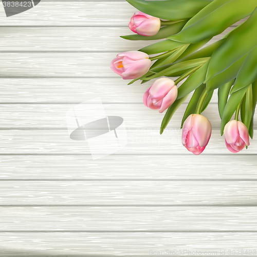 Image of Pink tulips over white wood table. EPS 10