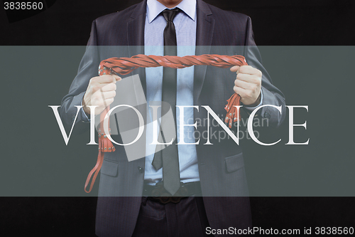 Image of man in business suit with chained hands. handcuffs for sex games. concept of erotic entertainment. violence