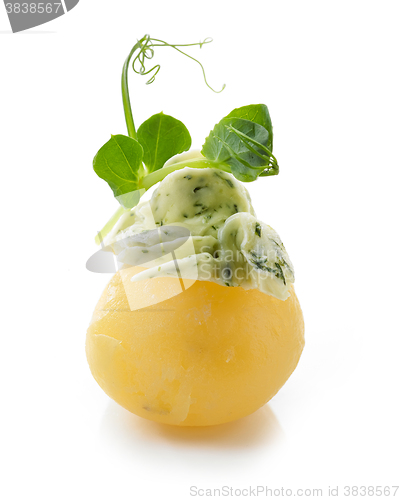 Image of boiled potato decorated with dill and garlic butter