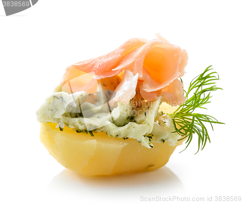 Image of boiled potato decorated with dill and garlic butter and salmon